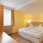 Photo of double room with shower, bath tub, WC