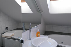 Bathroom with tub and shower