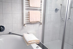 Bathroom with tub and shower