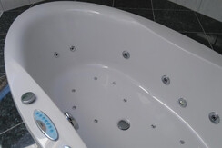 Bathroom with tub and shower