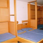 Photo of 4-bed room, shower, toilet